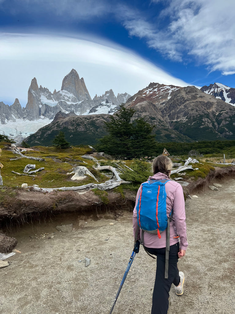 Woman hiking in the patagonia using hiking poles